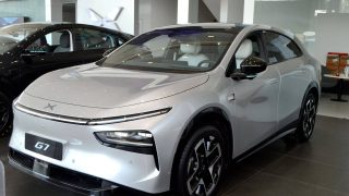 XPeng G7 SUV in silver on display at a dealer showroom