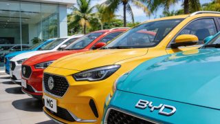 Chinese-brand electric vehicles displayed at a Southeast Asian car dealership